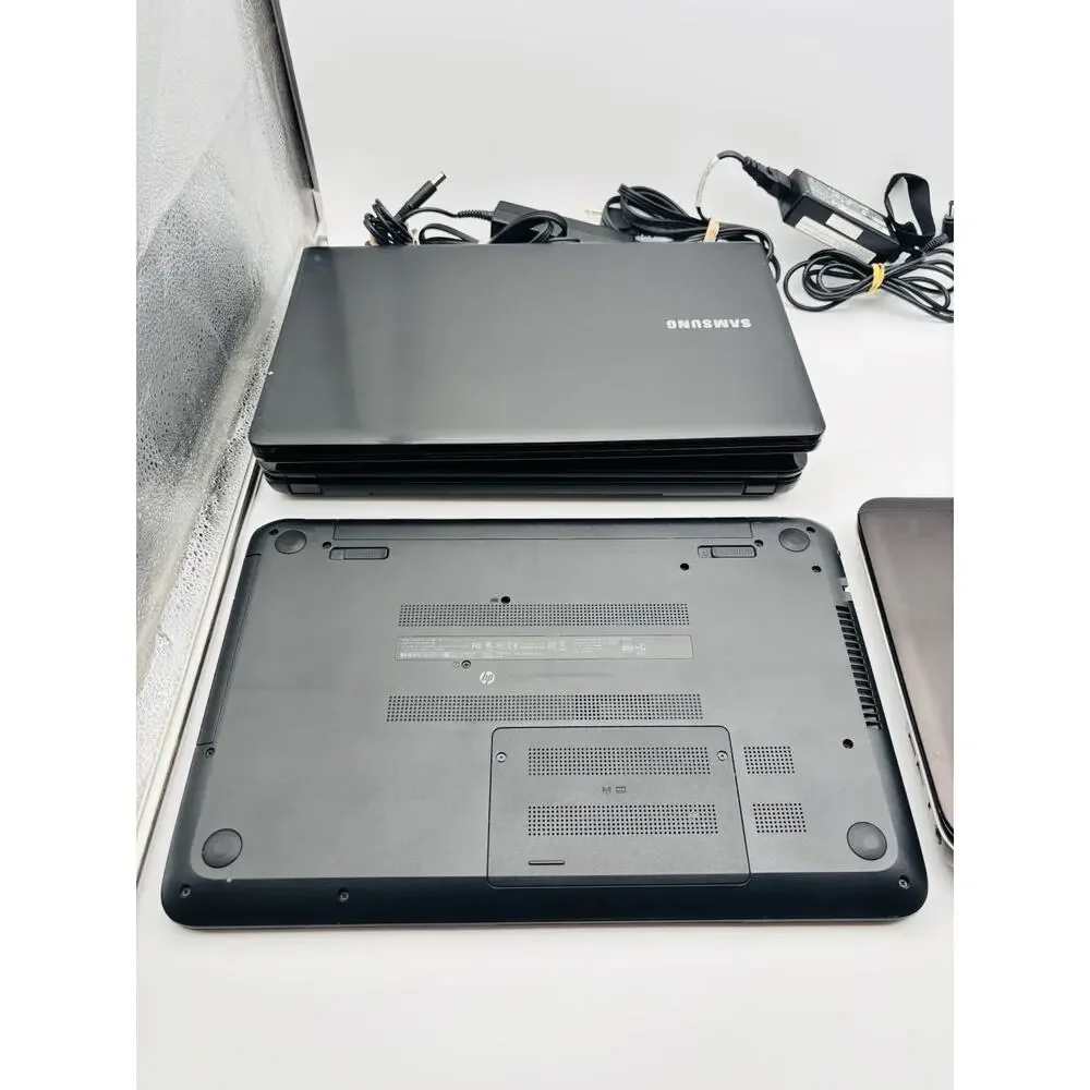 3 HP Laptop Computers With Cords. And 1 Samsung Laptop For Parts And Repair.